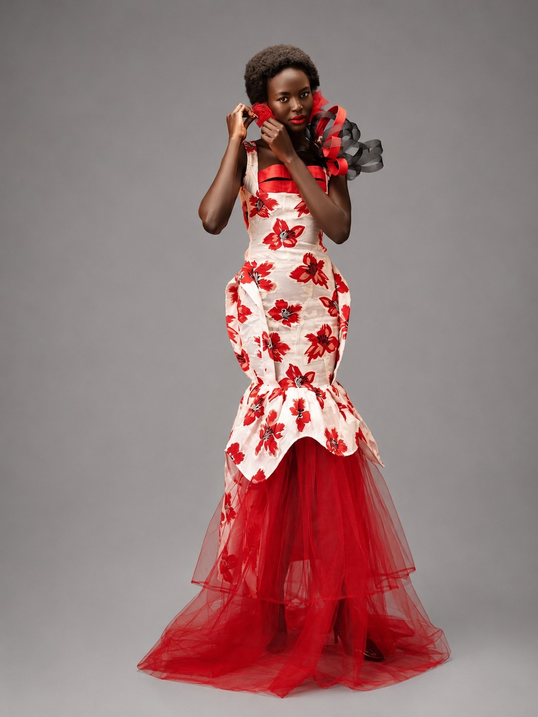 Model in the Crimson Bloom design posing against a soft backdrop